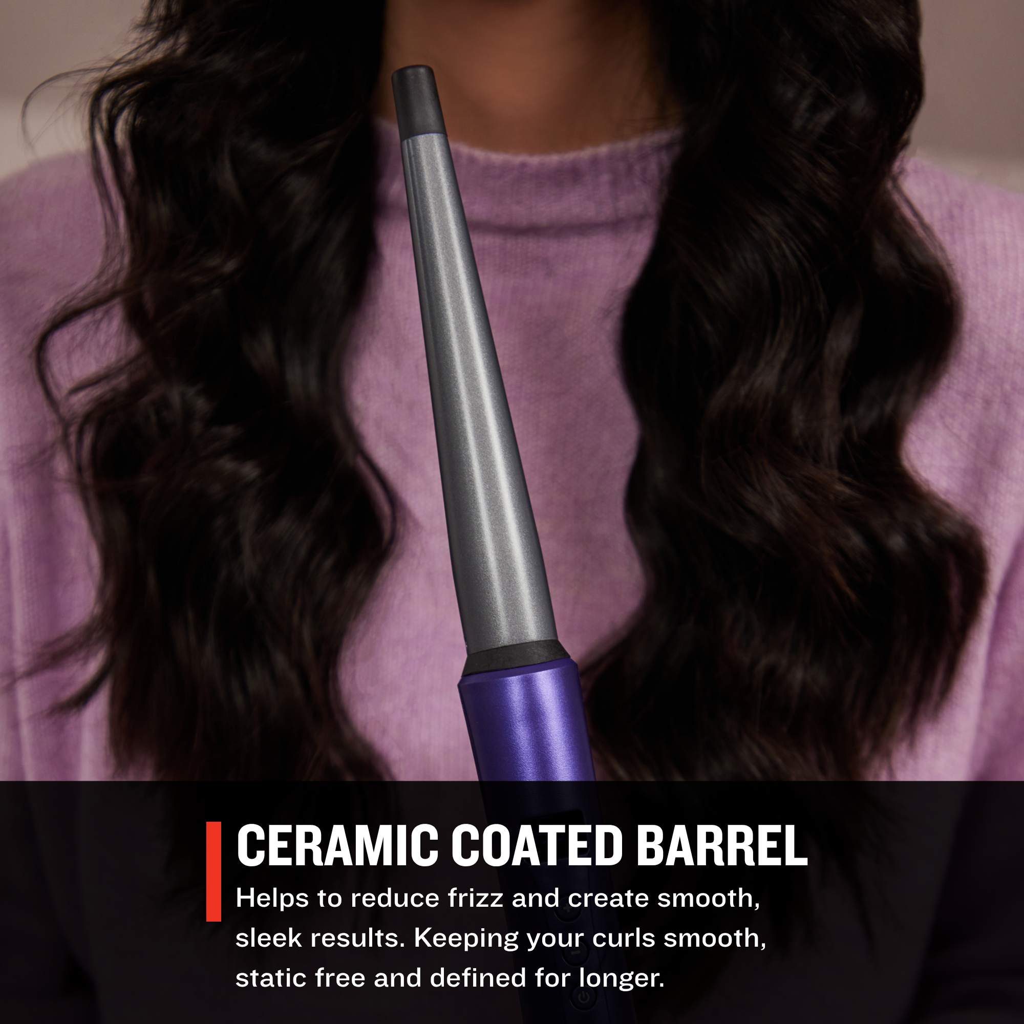 CI93X0US Gloss™ Tapered Curling Wandwith ceramic coated barrel held by a person with long, wavy hair.