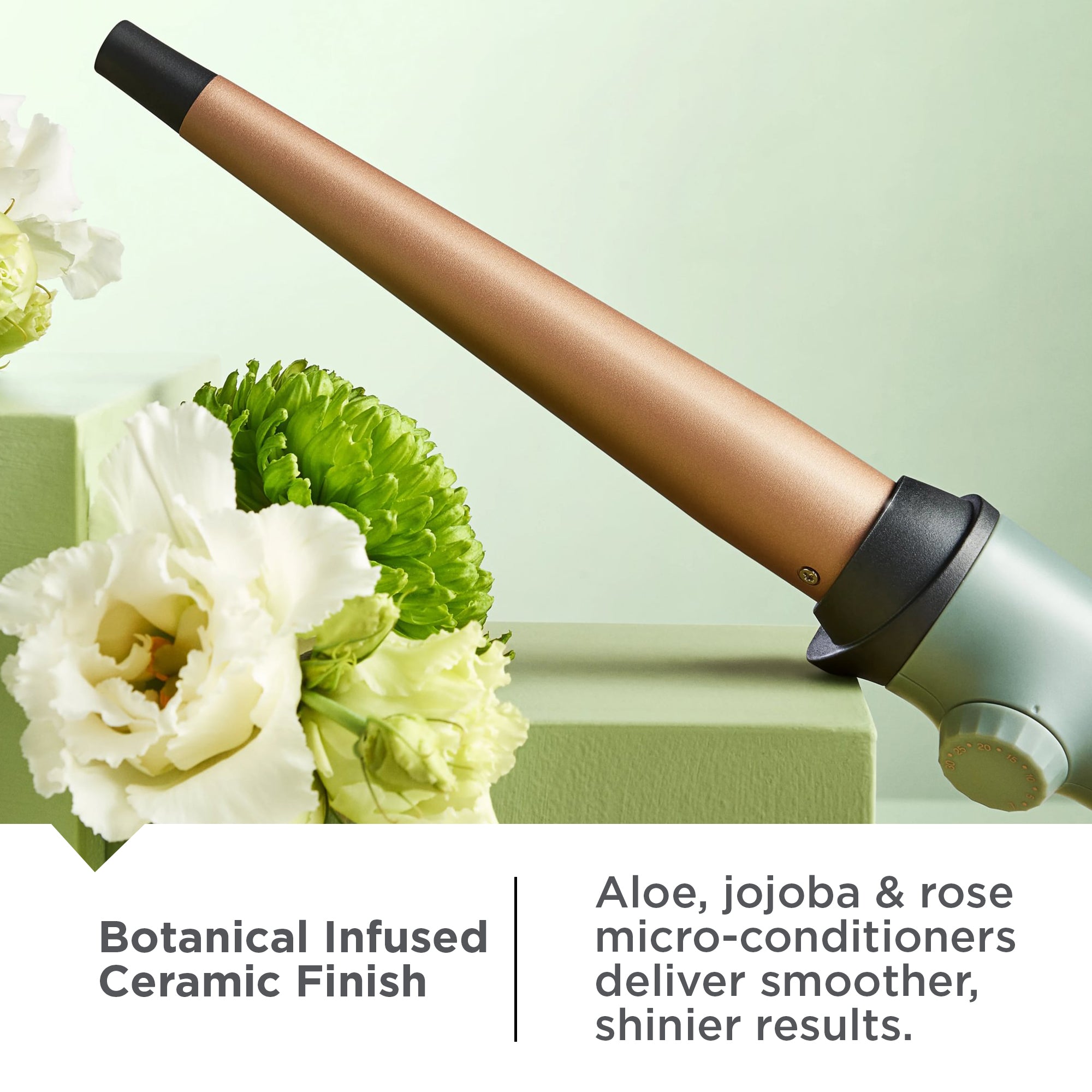 Botanicals™ Tapered Curling Wand with floral elements on a light green background