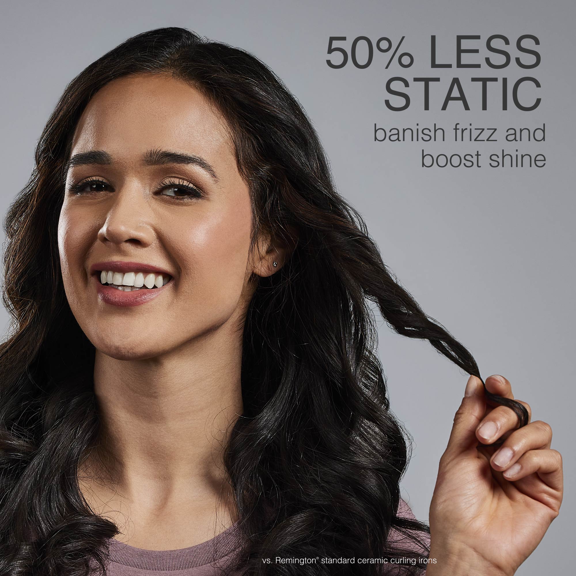 Woman with styled hair holding a section, with text about reducing static and improving hair shine.