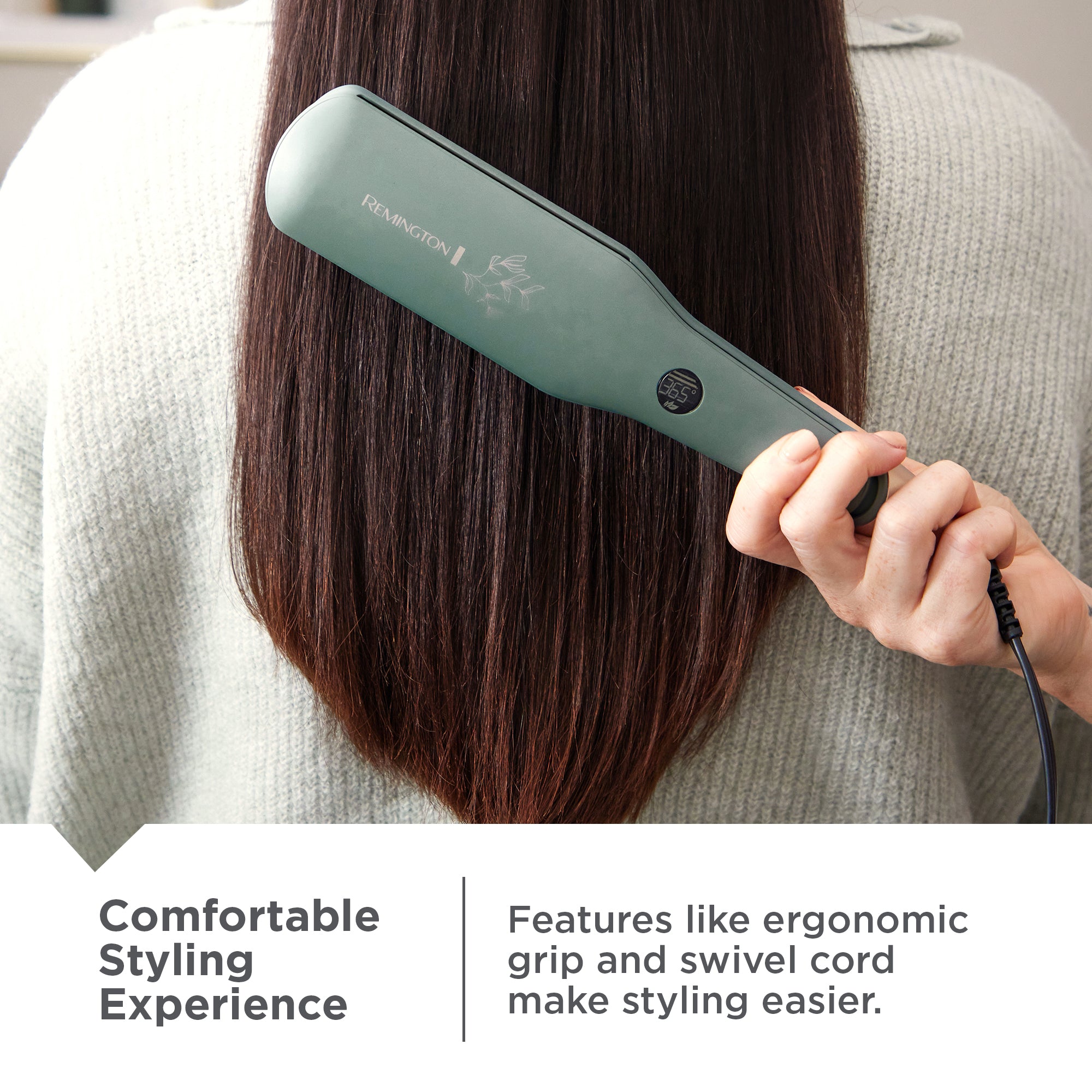 Person holding S5755NA Botanicals™ 2" Flat Iron against their straightened hair.