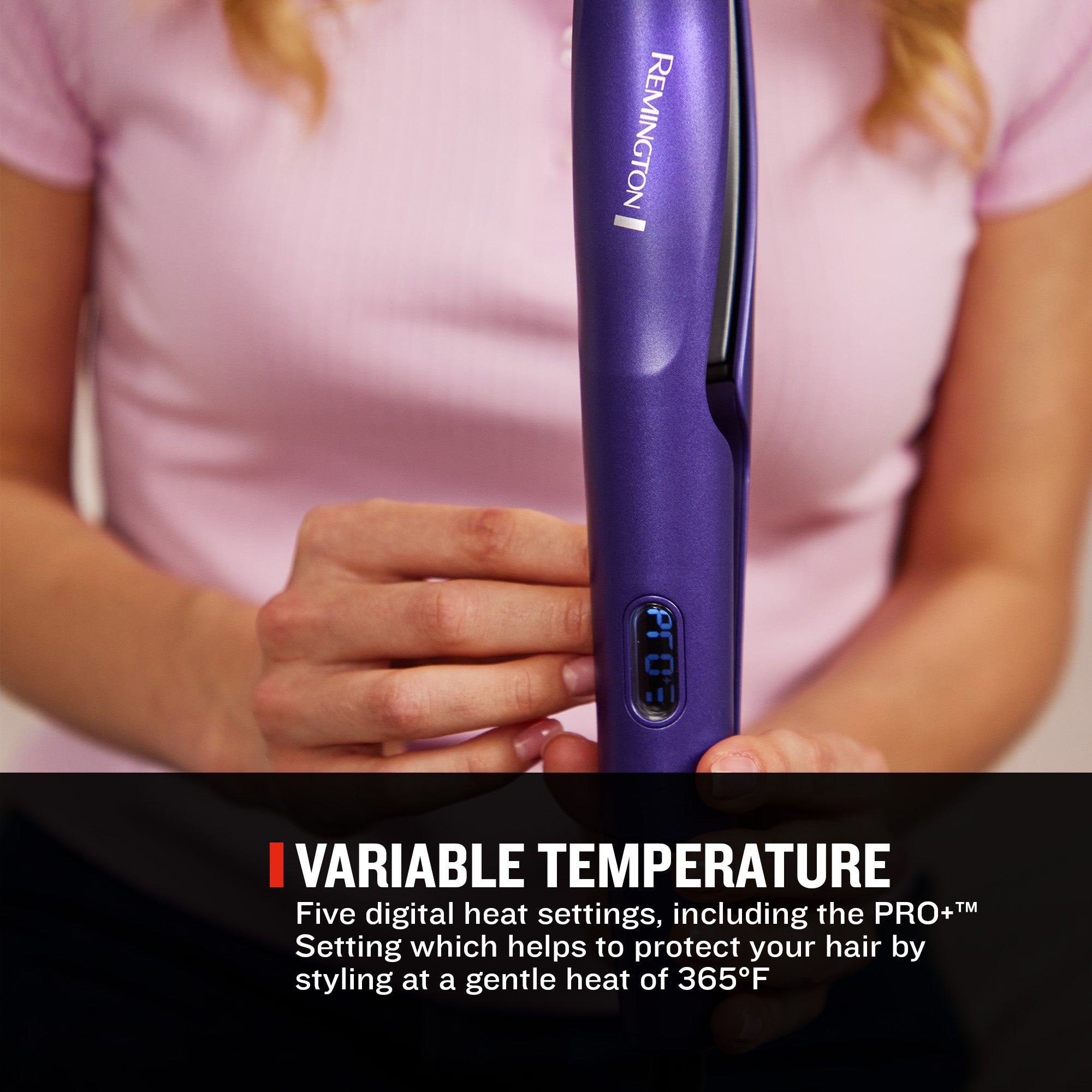 A person in a pink shirt holds a purple Remington hair styler with a digital temperature display. A black banner at the bottom reads 'VARIABLE TEMPERATURE' with descriptive text.