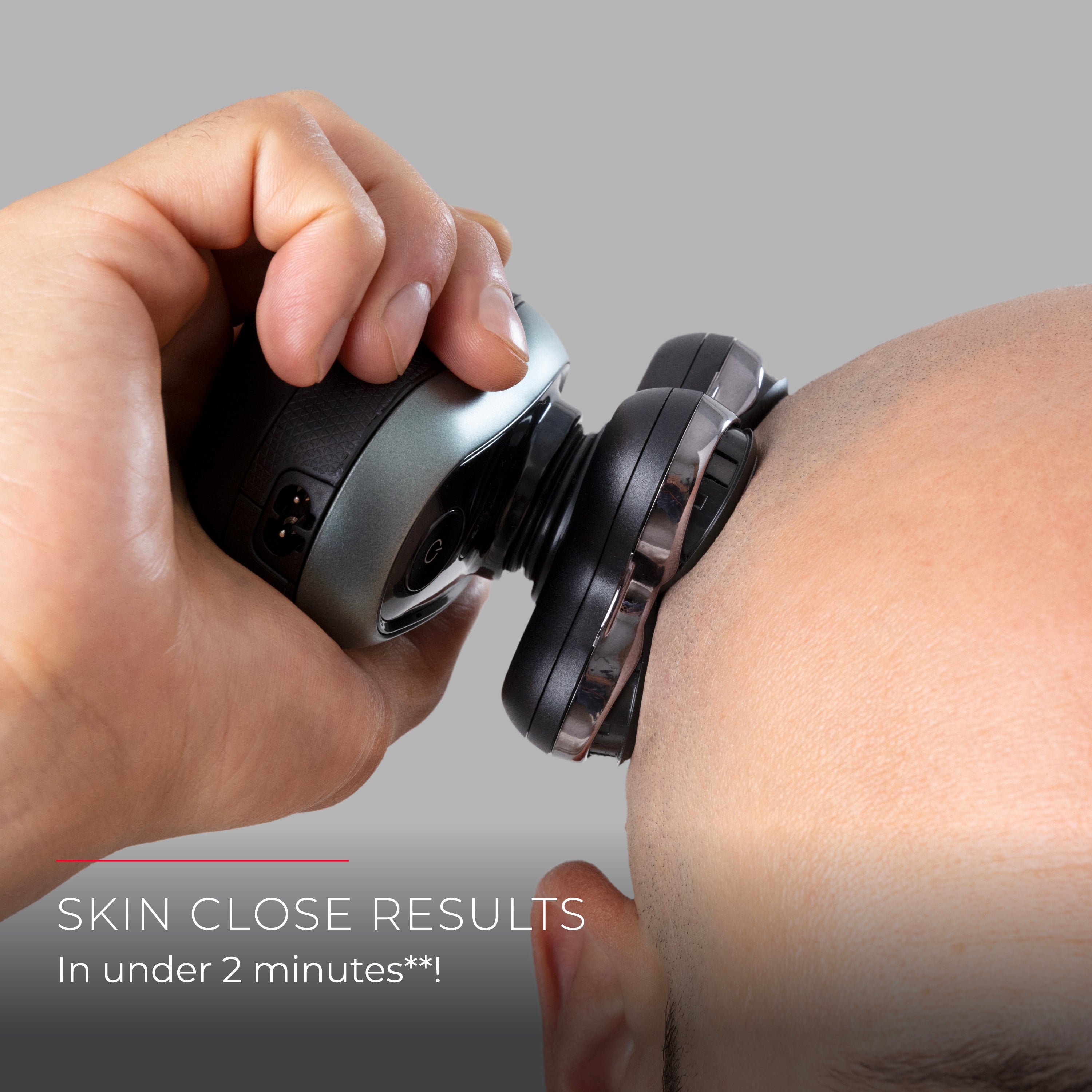 A close-up of a man shaving his head
