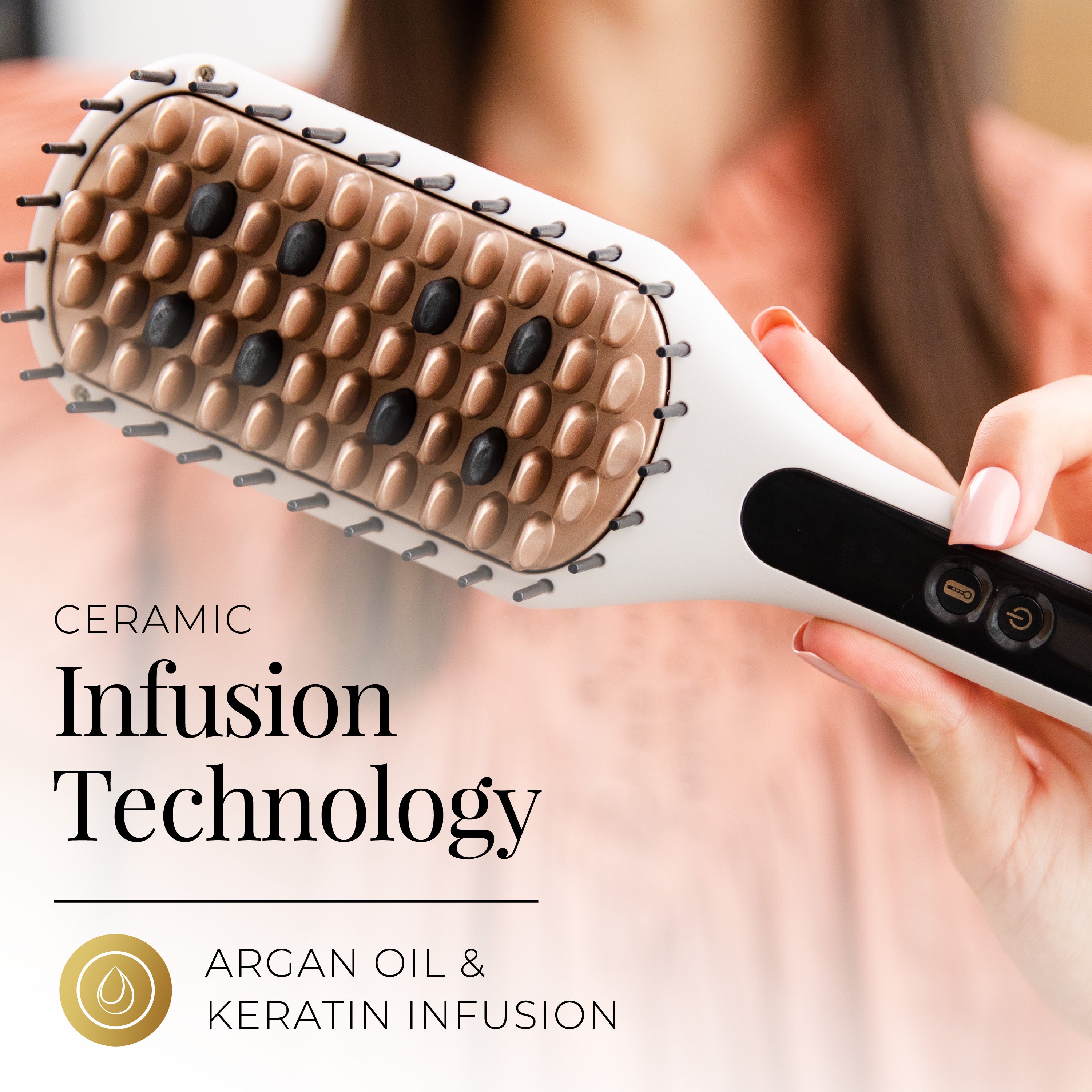 Hairbrush with ceramic infusion technology and argan oil & keratin infusion, held by a person.