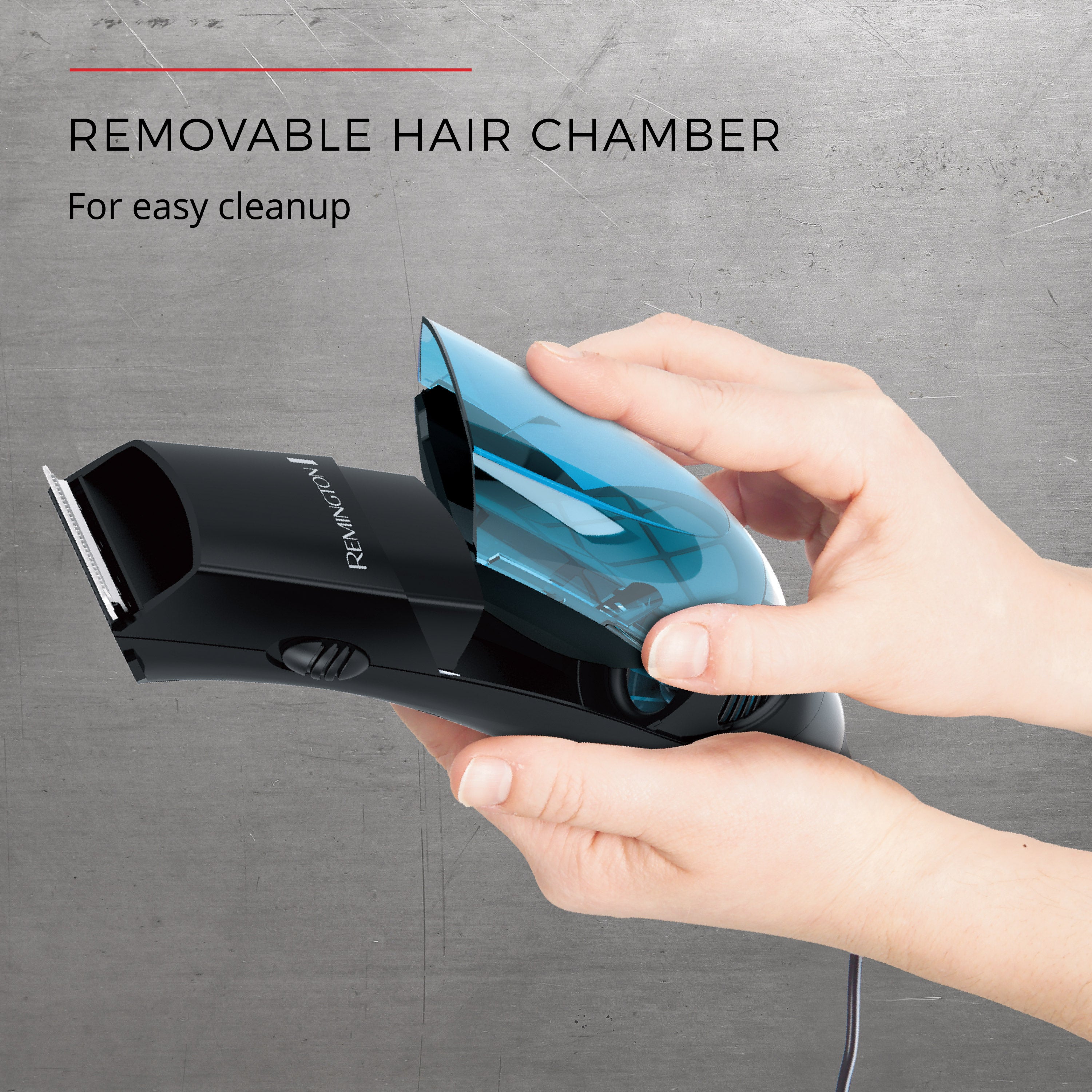 Hand holding a hair trimmer with a removable hair chamber on a gray background