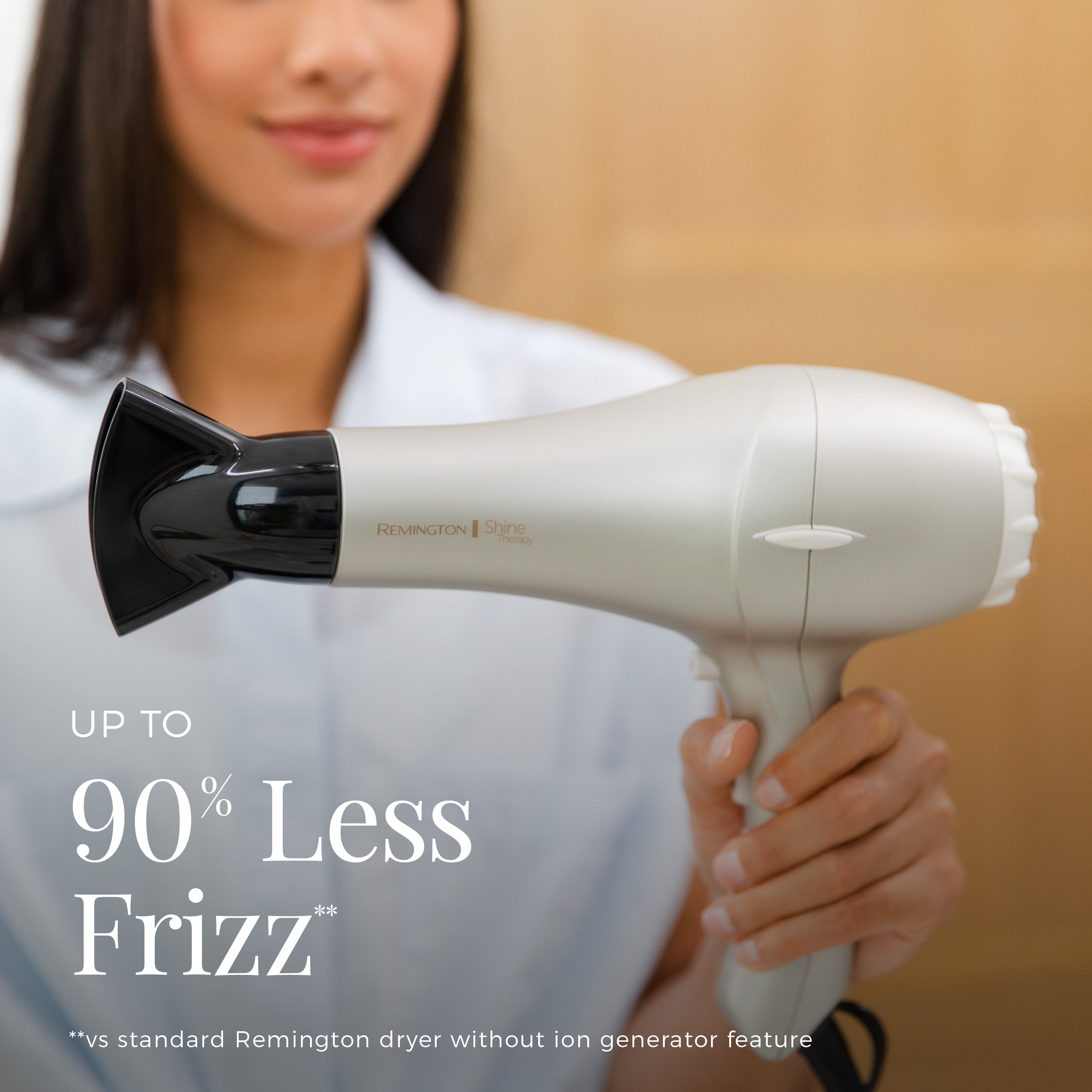 Woman holding a Remington hair dryer with text about frizz reduction.