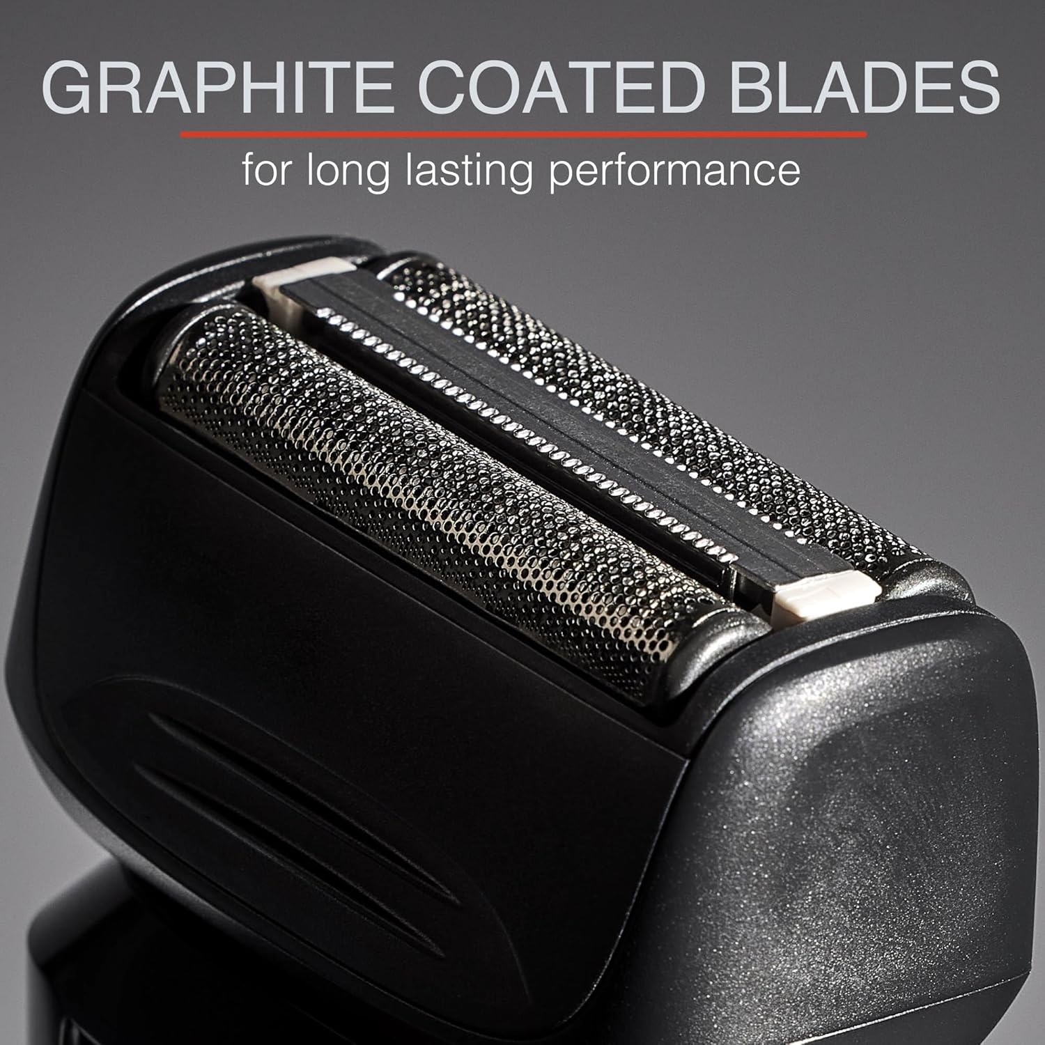 Close-up of a shaver head with graphite coated blades on a gray background