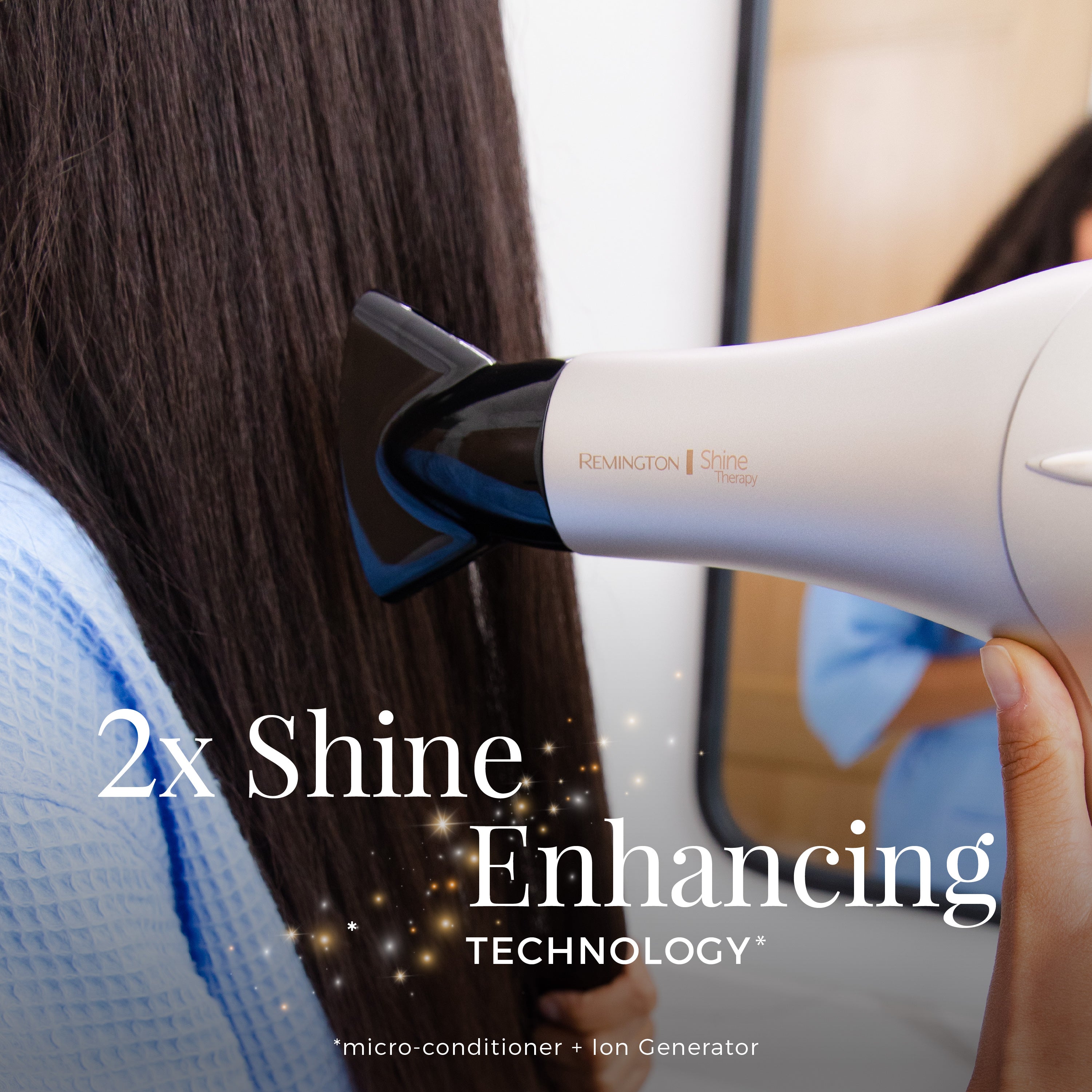 Hair dryer with '2x Shine Enhancing Technology' feature being used on hair.