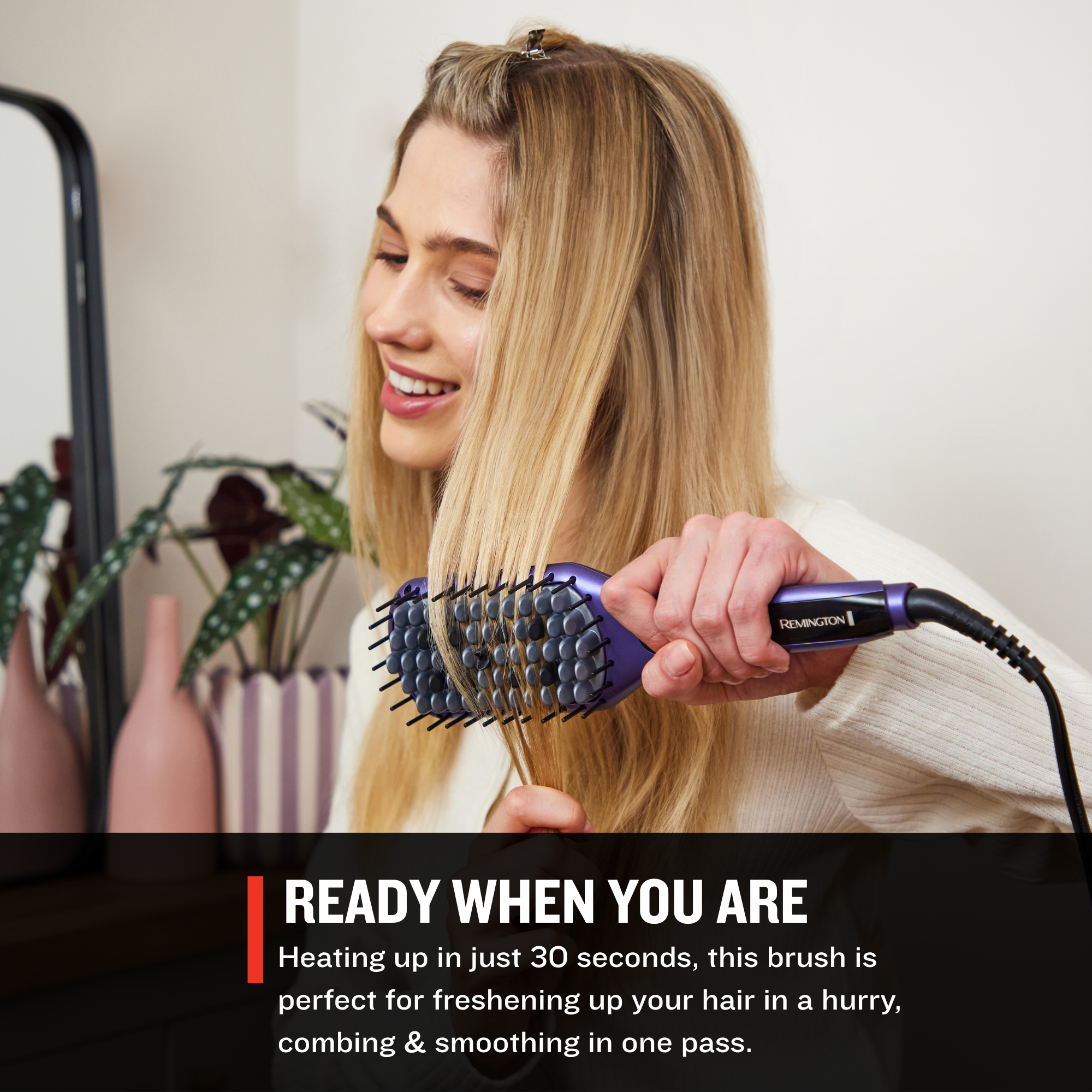 Woman using a CB9350US Gloss™ Straightening Brush with text about its quick heating feature