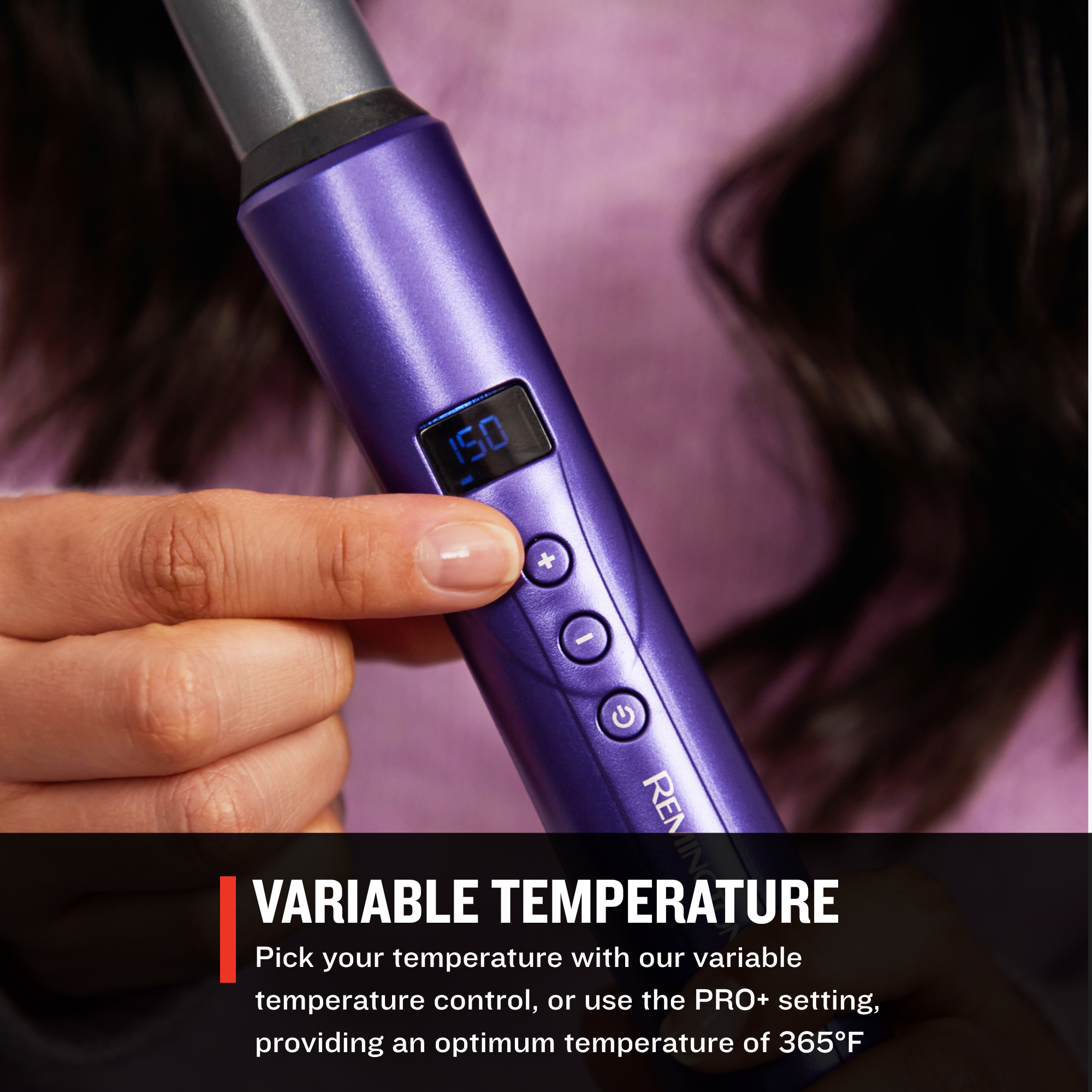 CI93X0US Gloss™ Tapered Curling Wand with digital display held by a person, against a blurred background.