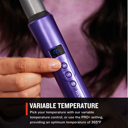 CI93X0US Gloss™ Tapered Curling Wand with digital display held by a person, against a blurred background.