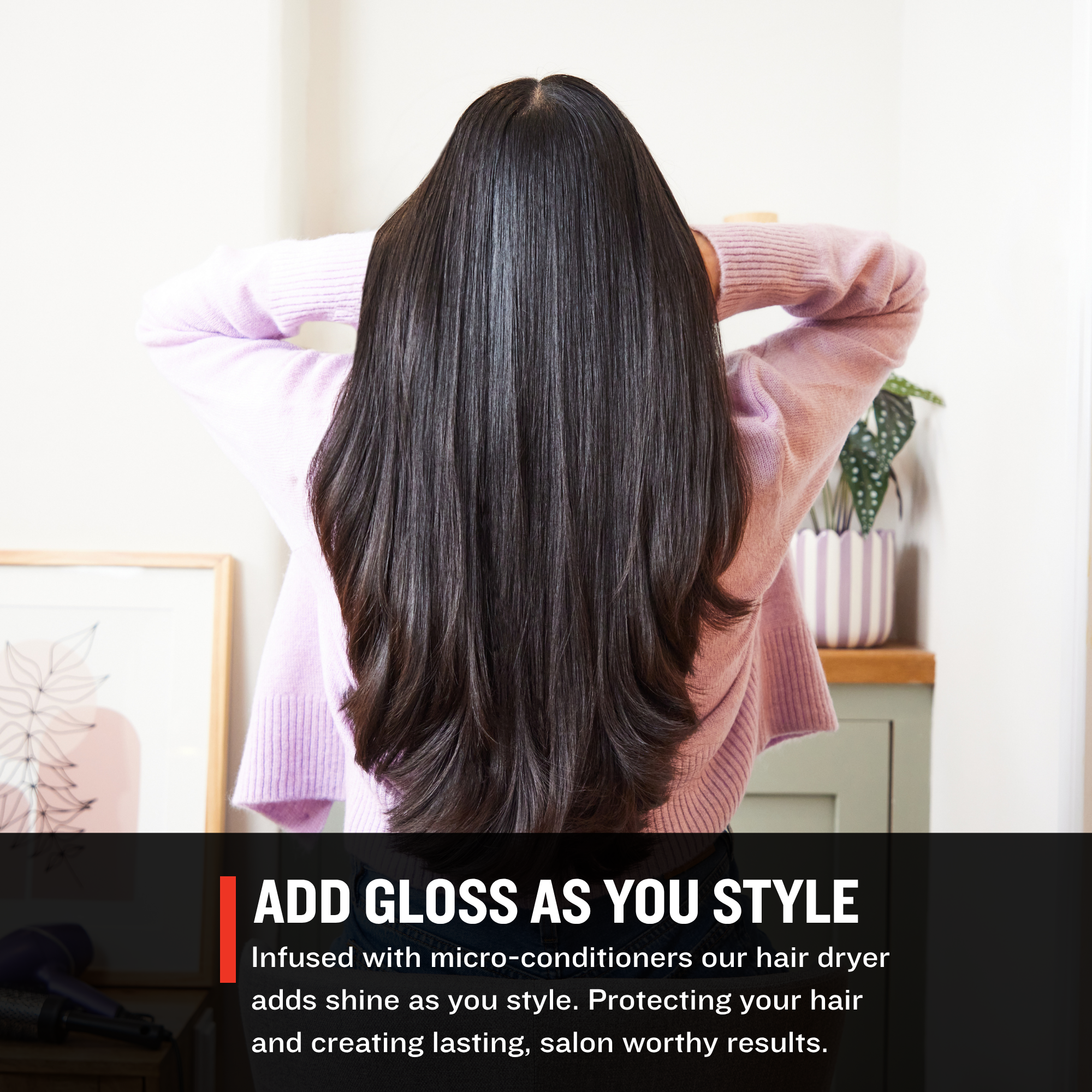 Person with long, straight hair in a room with text about a hair dryer's benefits.