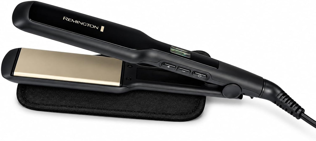 A black Remington hair straightener with a gold-toned heating plate, resting on a black fabric stand against a white background.