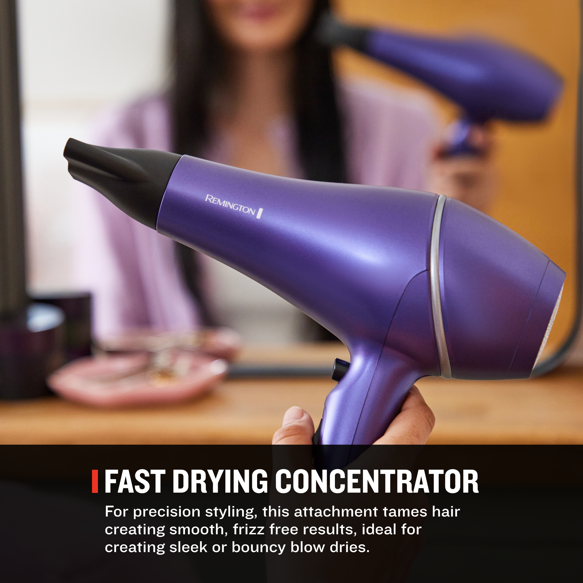 A purple hair dryer with a black concentrator nozzle attachment, held in front of a blurred background showing a woman using it. A black banner at the bottom reads 'FAST DRYING CONCENTRATOR' with descriptive text.