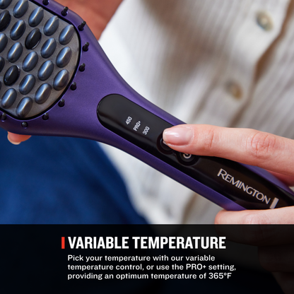 A close-up of a purple and black Remington hair straightener brush being held by a person, with a hand pressing the temperature control. The image includes a text banner at the bottom that reads 'VARIABLE TEMPERATURE' with descriptive copy.