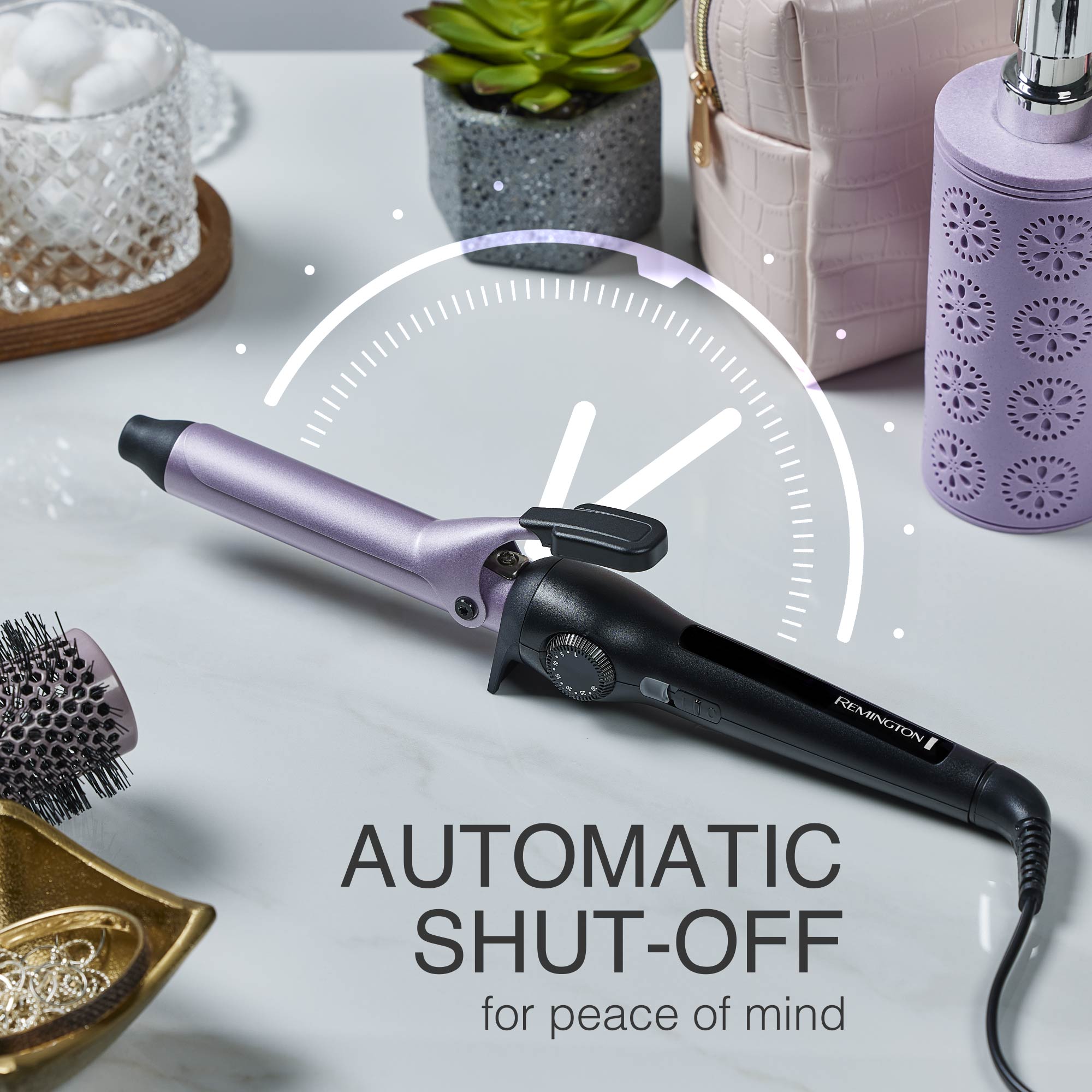 Curling Wand with automatic shut-off feature on a decorative surface