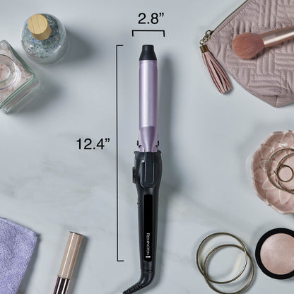 A curling iron with a lavender-purple barrel and black handle is shown on a light marble-style background with measurement lines and text indicating 12.4 inches length and 2.