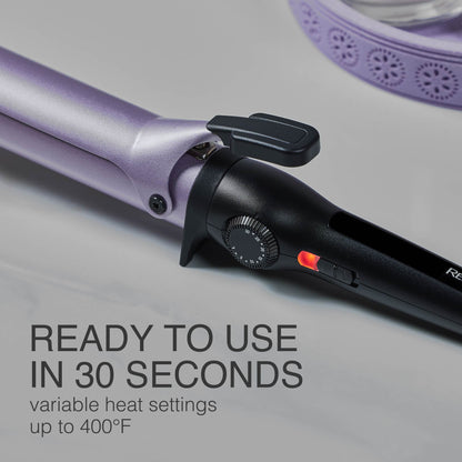 Purple hair curler with black control panel on a gray background