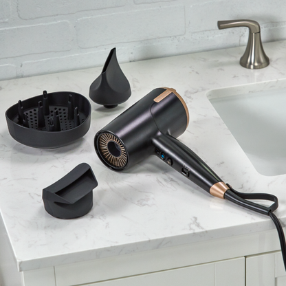 D31A10 Black hair dryer with attachments on a bathroom counter