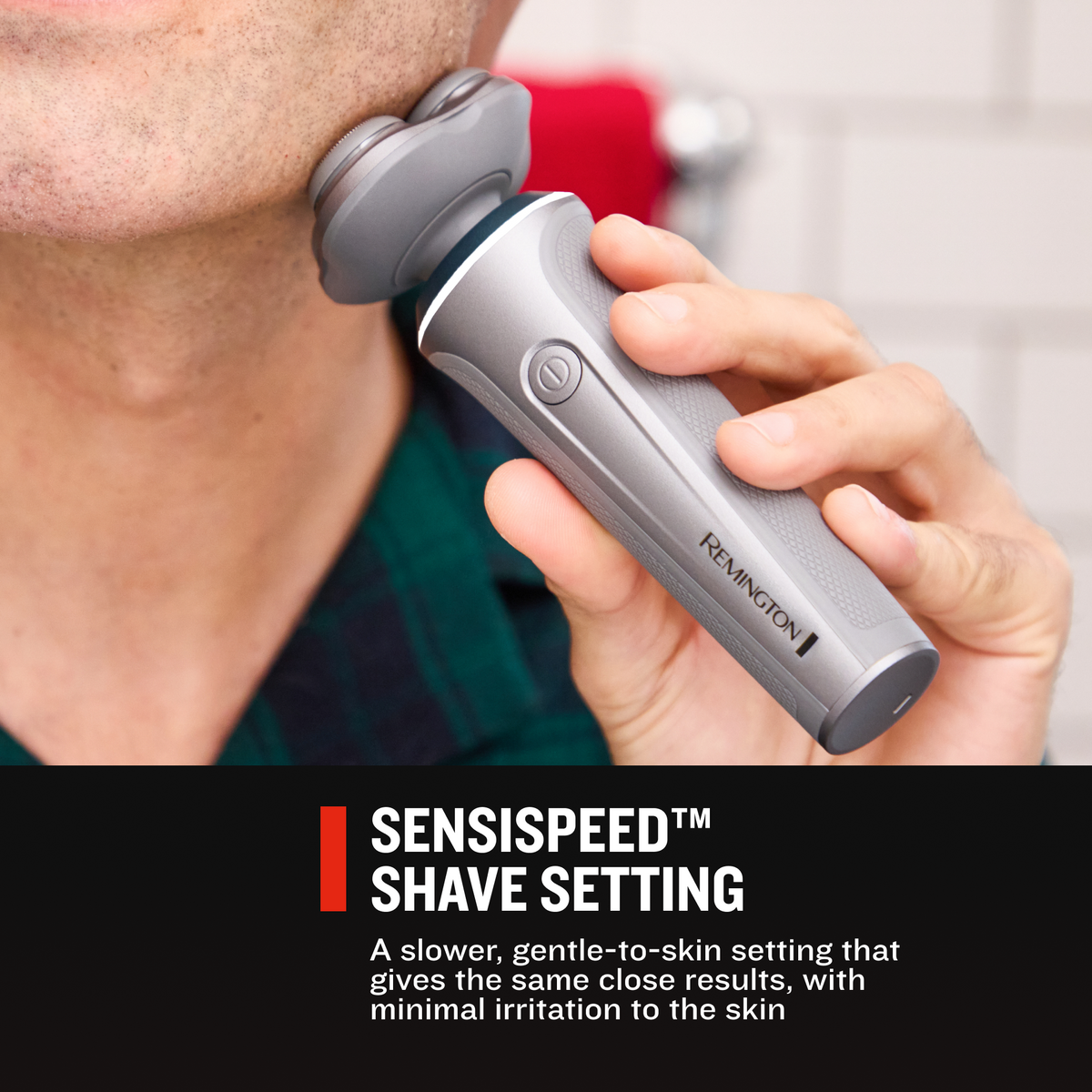 A close-up of a person holding a RC5390 Rotary shaver against their neck, shaving.