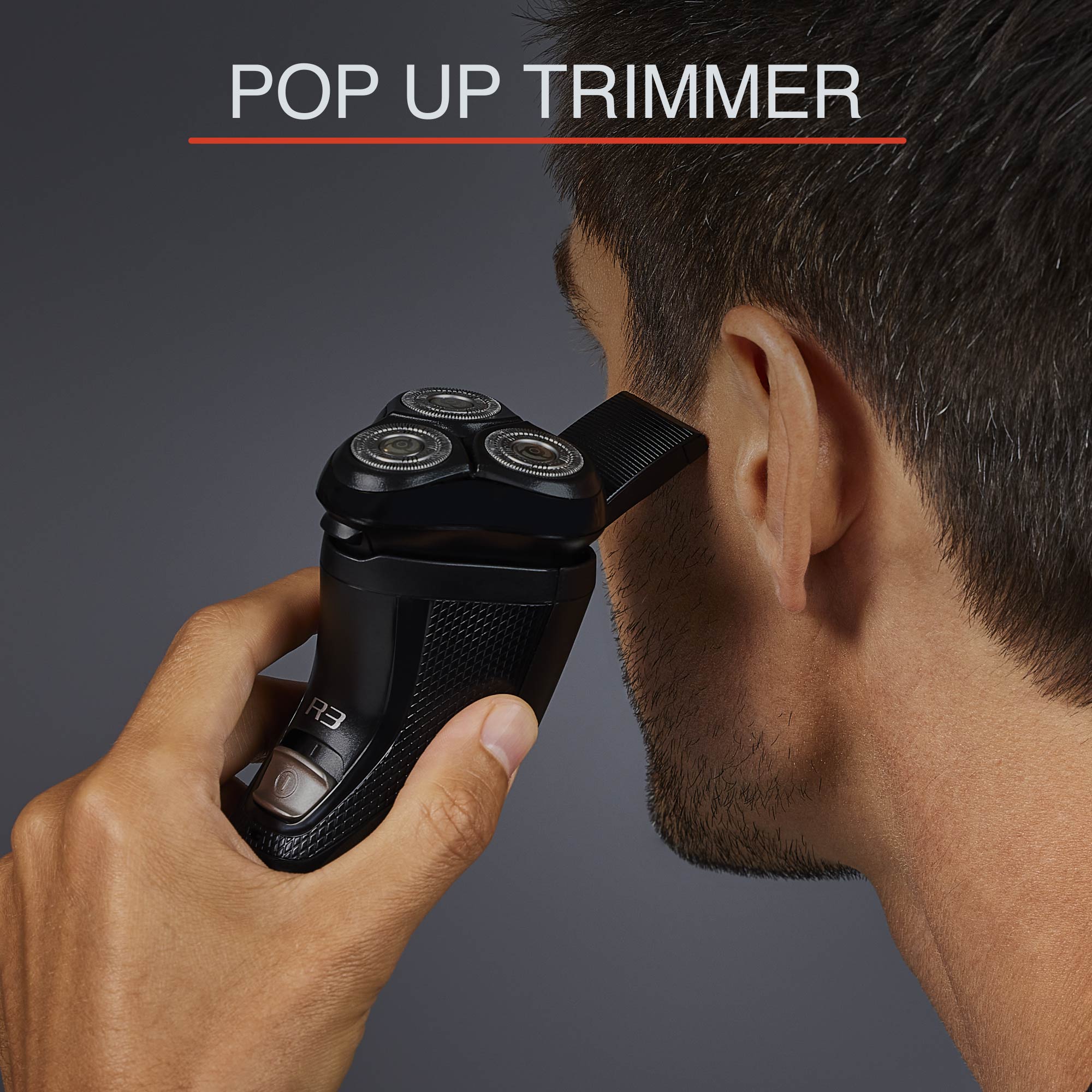 close up of man trimming his side burns with pop up trimmer