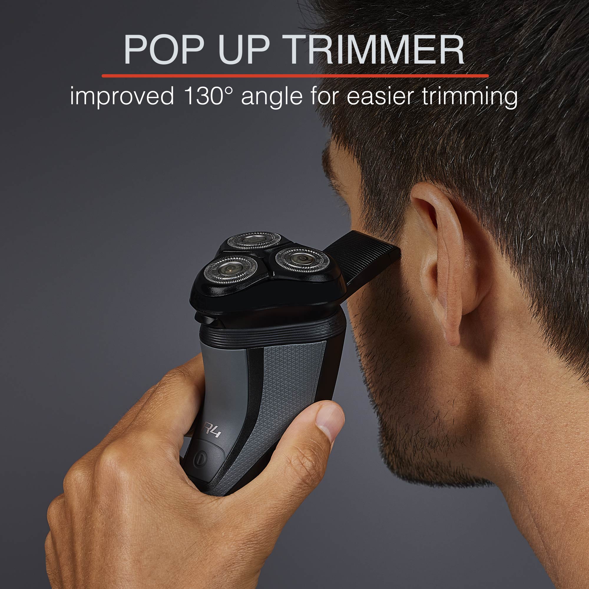 Man trimming his side burns with a pop up trimmer