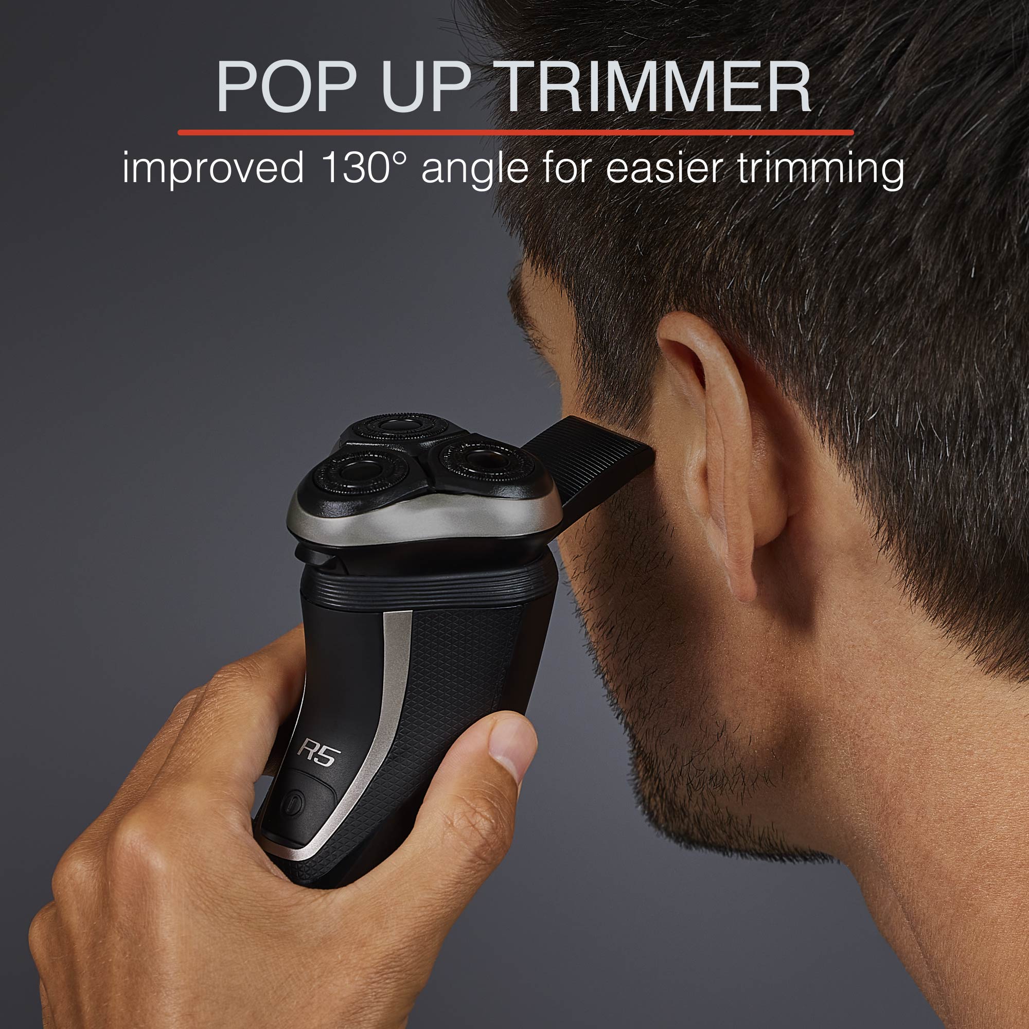 Person using a popup trimer to cut side burns
