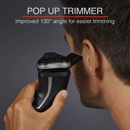 Person using a popup trimer to cut side burns