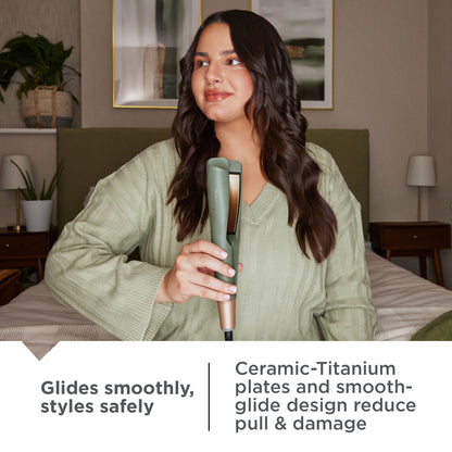 Woman holding a S5777NA Botanicals™ 1 Twist & Curl Multi-Styler in a bedroom setting
