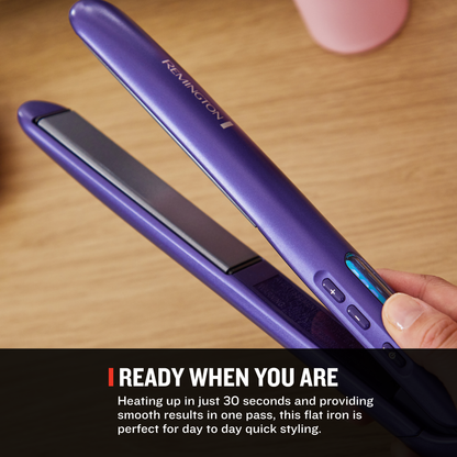 A purple Remington flat iron being held by a hand over a wooden surface, with a black text banner at the bottom reading 'READY WHEN YOU ARE' and descriptive copy.