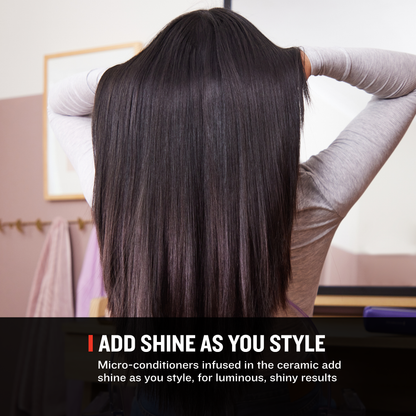 A woman seen from behind with very long, straight, glossy dark brown hair, wearing a light gray long-sleeve top. A text banner at the bottom reads 'ADD SHINE AS YOU STYLE' with smaller descriptive copy about micro-conditioners and ceramic shine enhancement.