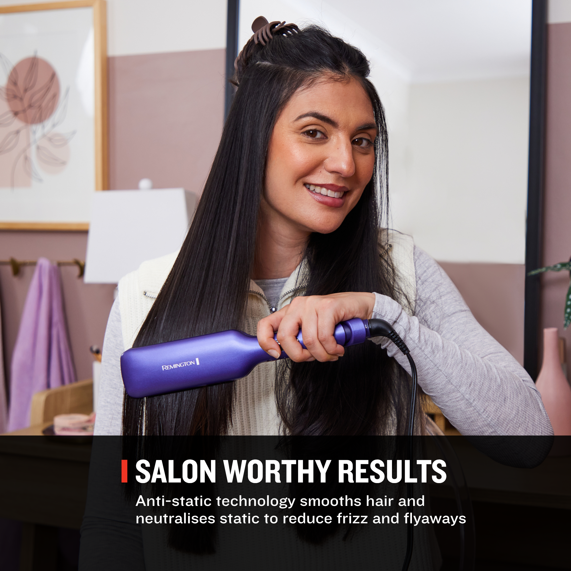 A woman with long, straight black hair holds a purple hair straightener in a salon-like interior. Text at the bottom reads 'SALON WORTHY RESULTS' and 'Anti-static technology smooths hair and neutralises static to reduce frizz and flyaways.
