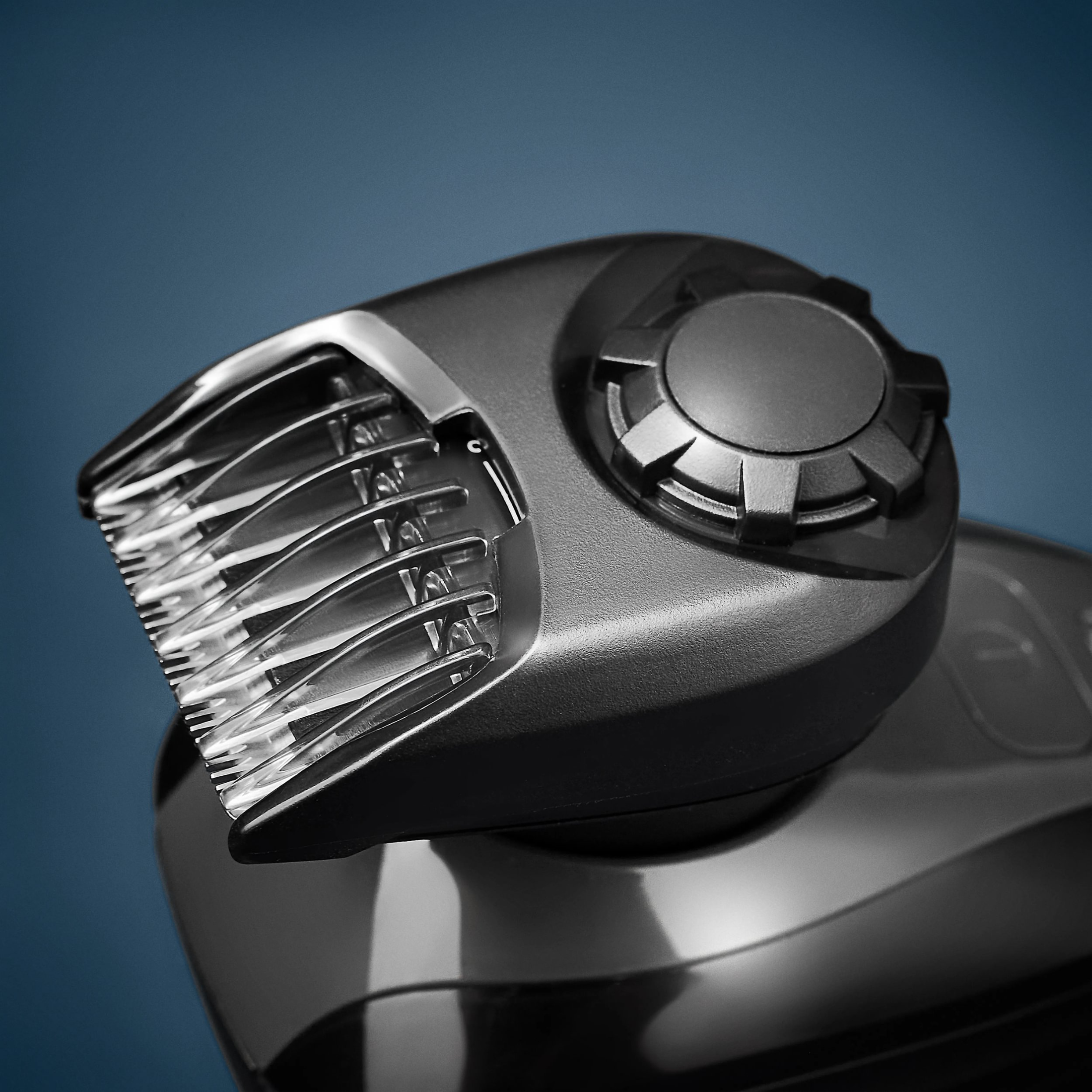 Close-up of a hair trimmer on a blue background