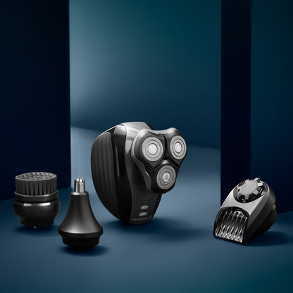 Shaver and attachments on a dark blue background