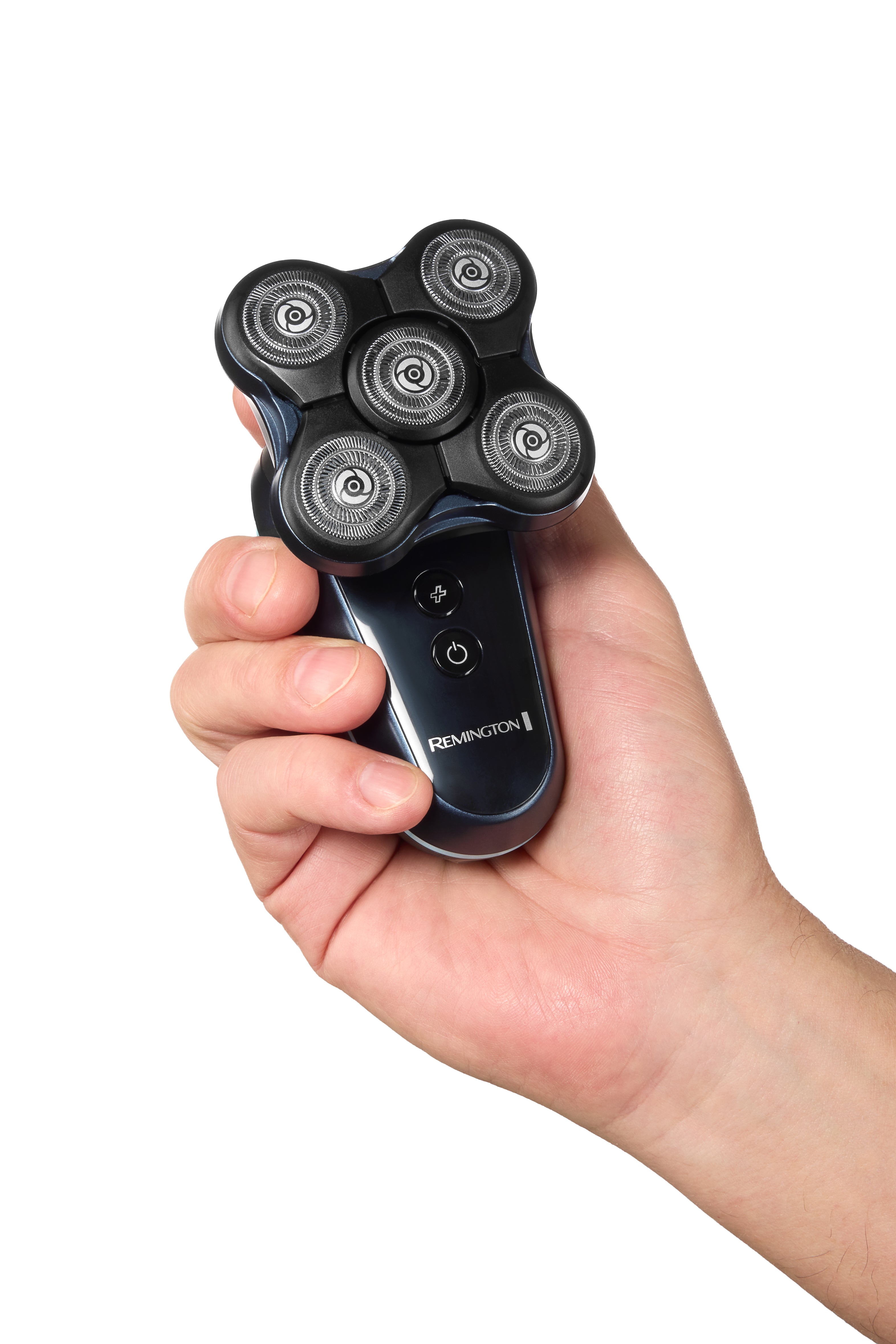 Electric shaver held in a hand with a white background