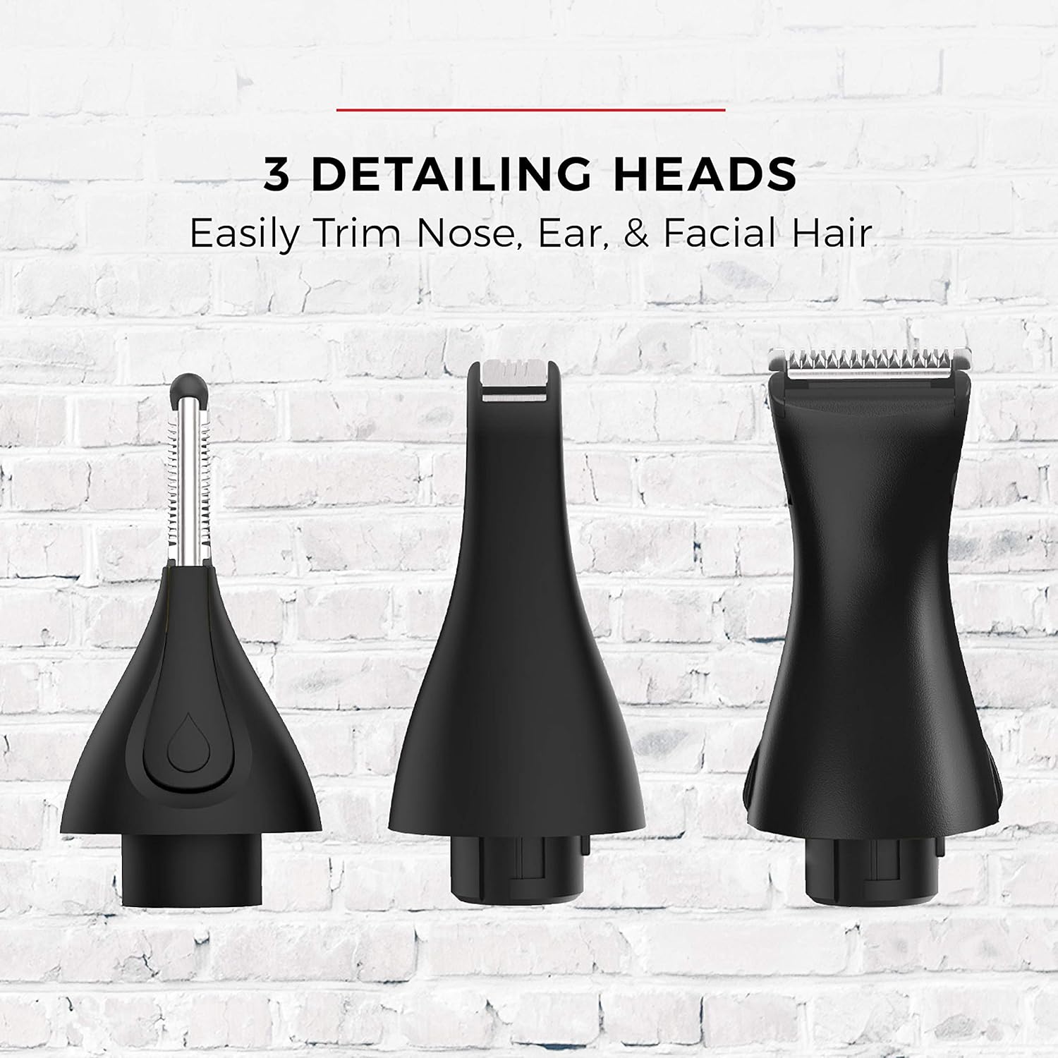 Three black detailing heads for grooming on a white brick wall background.