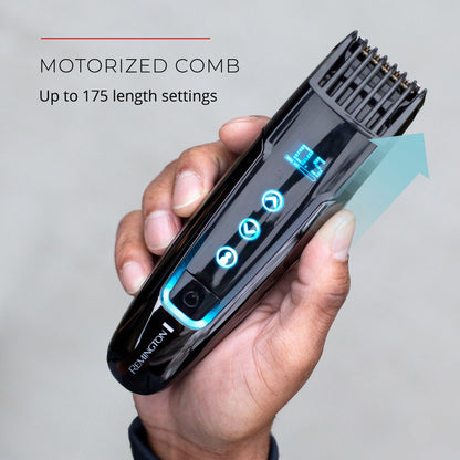 Motorized comb held in a hand with Remington branding on a gray background