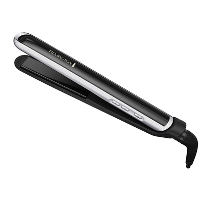 Black and silver Remington hair straightener on a white background