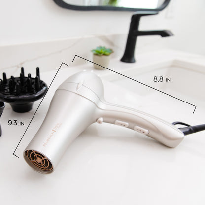 White hair dryer with measurements on a white surface
